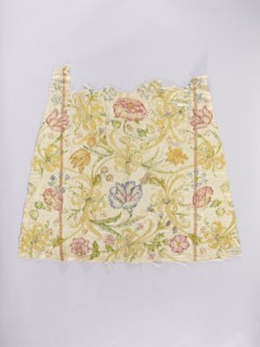 Two fragments of a dalmatic, front and back, of silk fabric interwoven with silver thread. The