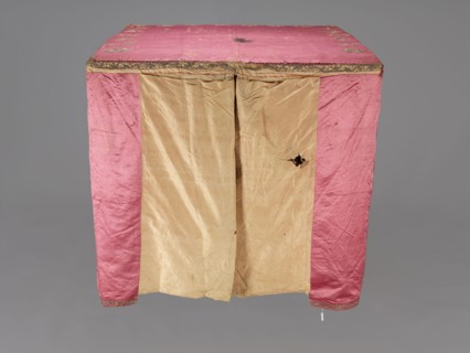 Church cope, liturgical vestment, raspberry satin embroidered with floral patterns. On the front,