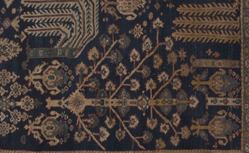 Carpet, The main field is filled with motifs of various species of trees arranged in three vertical