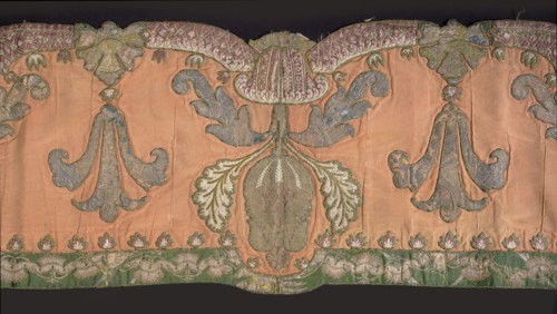 Lambrequin. Fragment of a lambrequin made of crimson silk grosgrain, sewn with fragments of