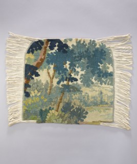 Tapestry chair cover, Repossession provenance. Depicts leaves, trees, landscapes, castle buildings