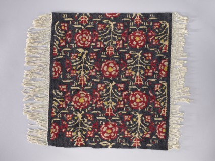 Tapestry covering; floral ornaments and stylized flower trees identical on the seat and backrest;