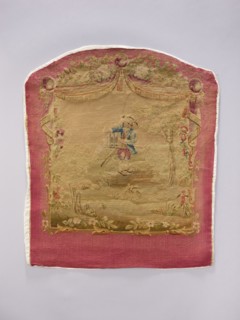 Tapestry covering depicting floral ornaments and boys in pastoral scenes, draperies suspended above