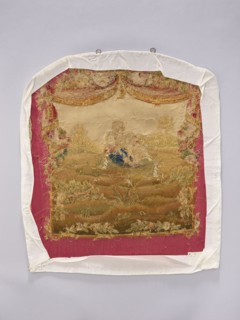 Tapestry covering, provenance, depicts flowers, floral ornaments, dogs, boys, pastoral scenes; used