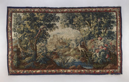 Tapestry-verdure, In the foreground, a river with overgrown banks and two large birds on opposite