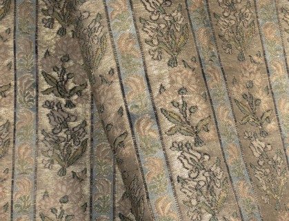 Fabric fragment. Gold-plated silk with a motif of irises and carnations in vertical stripes. Floral