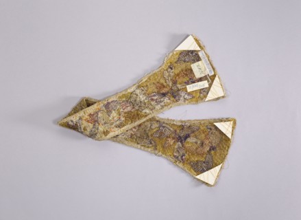 Maniple, gift; liturgical vestment, church parament. Embroidered with a leafy twig motif in silver,