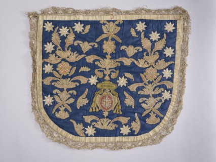 A hood from a church cope. The hood of the liturgical cope is made of navy blue silk with appliquéd