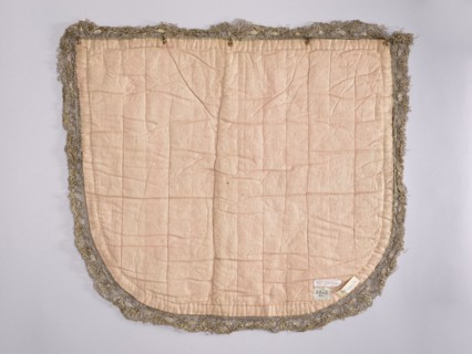 A hood from a church cope. The hood of the liturgical cope is made of navy blue silk with appliquéd
