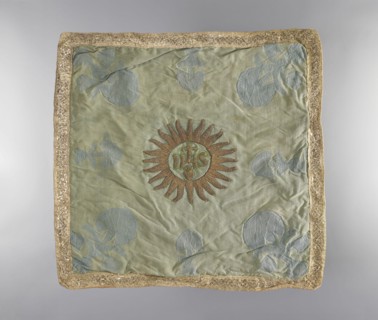 Velum., Velum made of blue silk fabric. In the center is an applied radiant medallion with the IHS