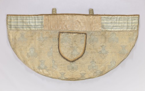 Church cope of silver brocade with Chinese motifs. Pretext sewn from two Polish fabrics—cream satin