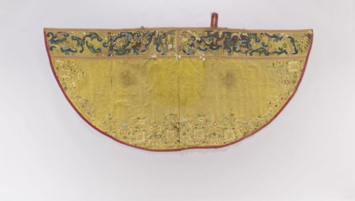 Church cope made of yellow silk fabric, embroidered along the edges with colorful floral sprigs