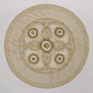Doily, unknown creator; round doily sewn from two pieces of machine lace, bobbin lace, and fabric