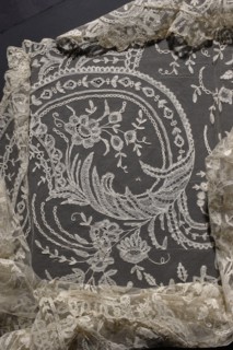 Cape, machine-made tulle background with floral tendril pattern sewn from hand-made, bobbin, and