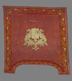 Saddle pad — kilim in a near-square form with slightly elongated upper corners. Main field:
