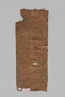 Fragment of a brocade with a large repeat, probably a net composition, with stylized plant motifs
