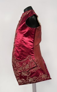 Men's vest made of cherry satin, embroidered. Straight cut, sleeveless and collarless. Diagonal