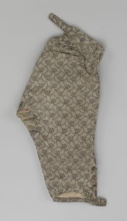 Trousers, short knee-length trousers sewn into a wide belt with a buttoned fly, made of silver lamé