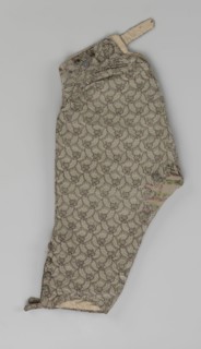 Trousers; short, knee-length trousers sewn into a wide belt, with a buttoned fly, made of silver