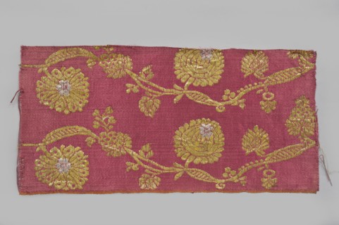 Fabric fragment, fragments of silk patterned semi-silk fabric with a red background in a satin