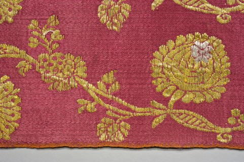 Fabric fragment, fragments of silk patterned fabric with plant motifs, indigo and brazilwood dyes.