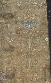 Fabric fragment, silk, fragments of patterned floral/plant motifs. Stylized plant motifs on a