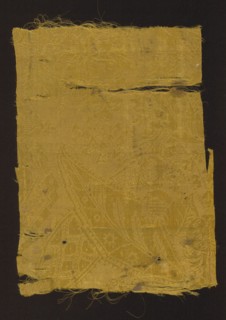 Fabric fragment, patterned silk damask, early 18th century, France. Fragment of yellow semi-silk