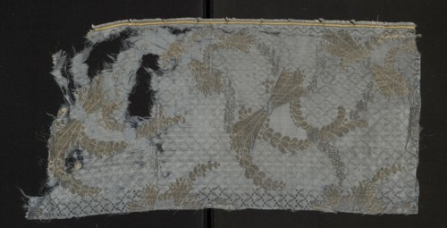 Fabric fragment, fragments of silk patterned fabric, report composition based on two intersecting