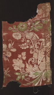 Fabric fragment. Fragments of silk patterned fabric with plant patterns; stripe decorated with