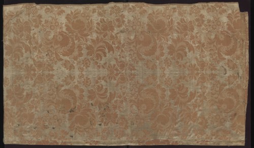 Fabric fragment. Fragment sewn from two salmon-white damask-type fabrics promoted stripes,