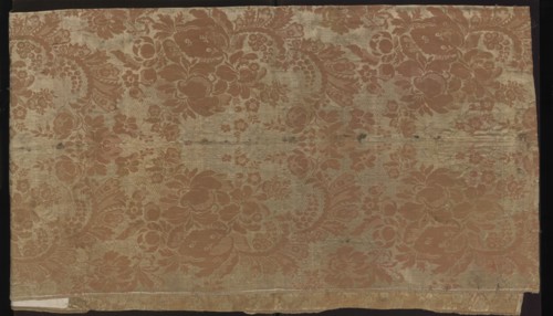 Fabric fragment. Fragment sewn from two salmon-white damask-type fabrics promoted stripes,
