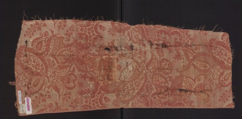 Fabric fragment, fragments of a larger textile object, patterned silk fabrics, pale red pink lampas