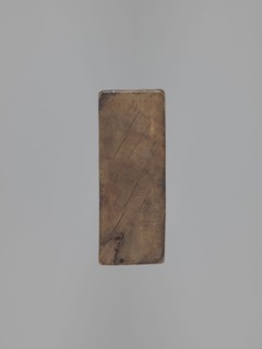 Double-sided gingerbread mould. Side A: bison; Side B: three figures — a bachelor in early