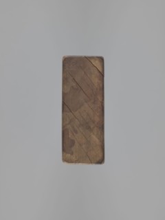 Double-sided gingerbread mould. Side A: bison; Side B: three figures—a bachelor in