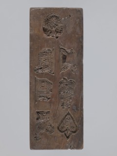 Double-sided gingerbread mold; obverse: seven different motifs — a heart, a rooster, a dog in front