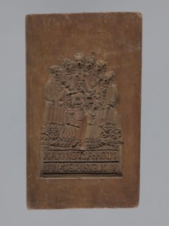 Double-sided gingerbread mould. Obverse: group of figures—two women and a child; rectangular form;