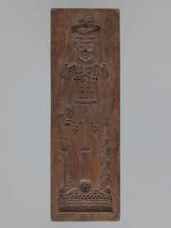 Double-sided gingerbread mould. Side A: image of a soldier; Side B: baby in swaddling clothes.,