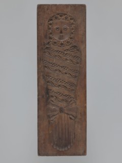 Double-sided gingerbread mould. Side A: image of a soldier; Side B: baby in swaddling clothes.,