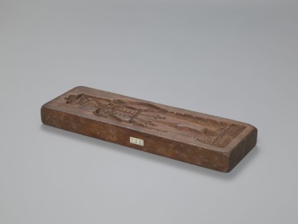 Double-sided gingerbread mould. Side A: image of a soldier; Side B: baby in swaddling clothes.,