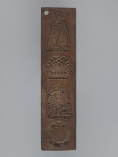 Double-sided gingerbread mould. Obverse: four images—top: female figure in a long patterned dress