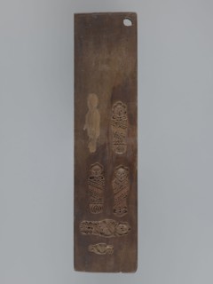 Double-sided gingerbread mould. Obverse: four images of human figures and plant motifs; Reverse: