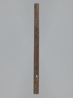 Double-sided gingerbread mould. Side A: female figure in a decorative bonnet and long patterned