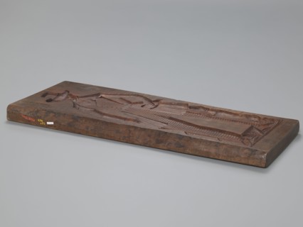 Double-sided gingerbread mould. Side A: female figure in a decorative bonnet and long patterned