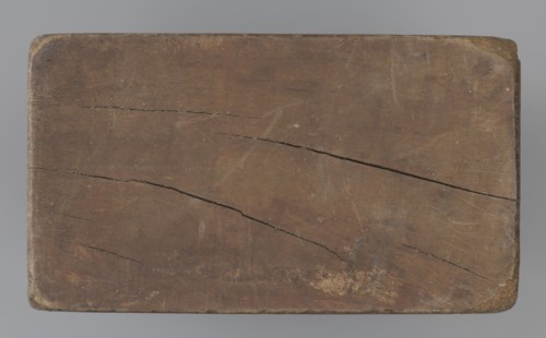 Double-sided gingerbread mould. Side A: figure of a lady in a decorative, pleated dress from the
