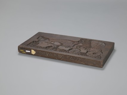 Double-sided gingerbread mould. Obverse: image of a trumpeter on a horse; Reverse: horse-drawn