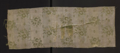 Fragment of a solid silk fabric, patterned, with preserved floral motifs: two joined branches with