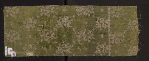 Fragment of a solid silk fabric, patterned with two joined branches bearing unfolded roses and