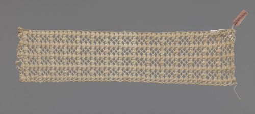 Fragment of crocheted lace — section of a belt, cream-colored, with motifs of semicircular shells