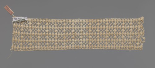 Fragment of crocheted lace — section of a belt, cream-colored, with motifs of semicircular shells