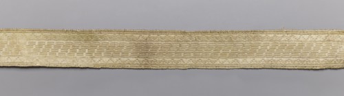 Gallon, galloons haberdashery, geometric ornaments, white warp, weft - wire - drawn thread. Faint